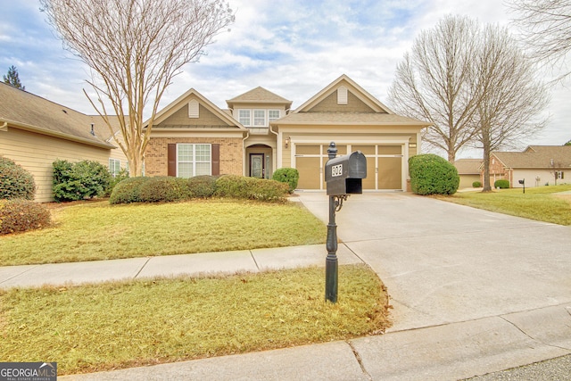 view of front of property with a garage and a front yard