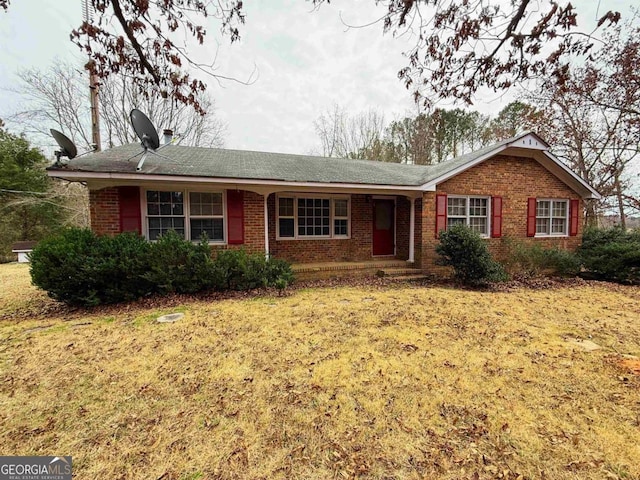 ranch-style home with a front yard