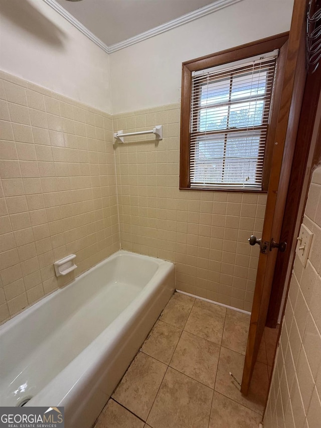 bathroom with tile walls, crown molding, and tile patterned floors