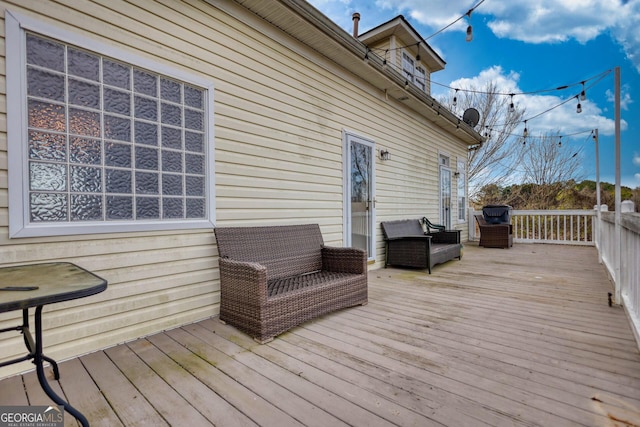 wooden deck featuring an outdoor hangout area