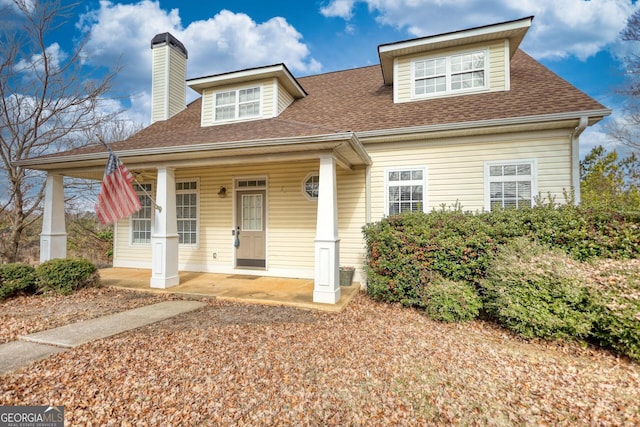 cape cod-style house with a porch