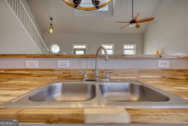 details featuring butcher block counters and sink