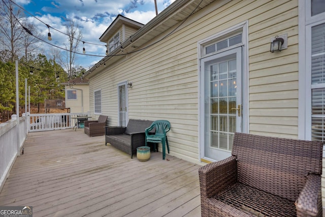 deck featuring outdoor lounge area