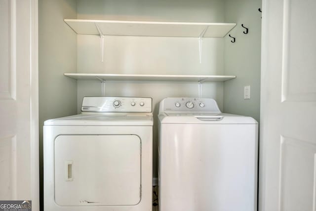 laundry area with independent washer and dryer