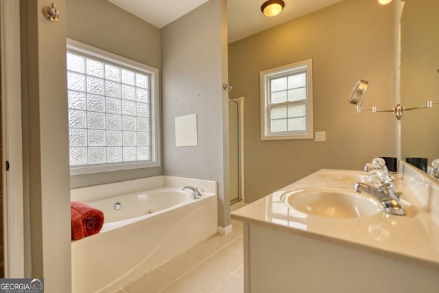 bathroom featuring tile patterned flooring, vanity, plenty of natural light, and shower with separate bathtub