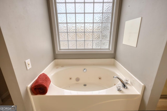 bathroom with a washtub