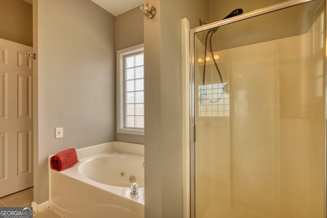 bathroom with tile patterned floors and separate shower and tub