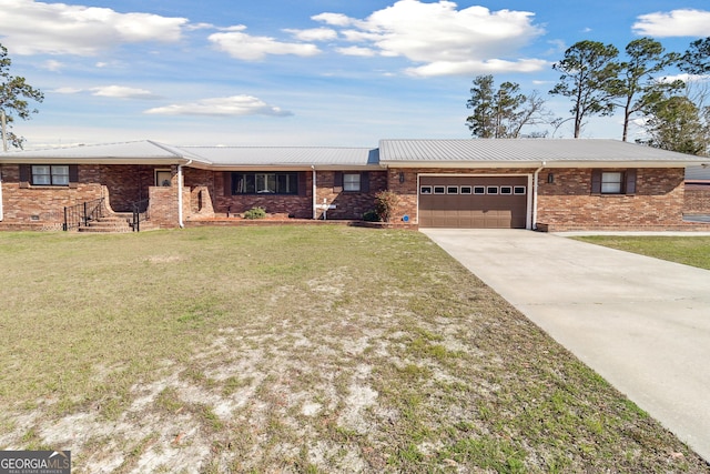 ranch-style home featuring a garage and a front yard