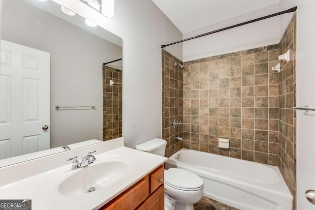 full bathroom featuring vanity, toilet, and tiled shower / bath combo