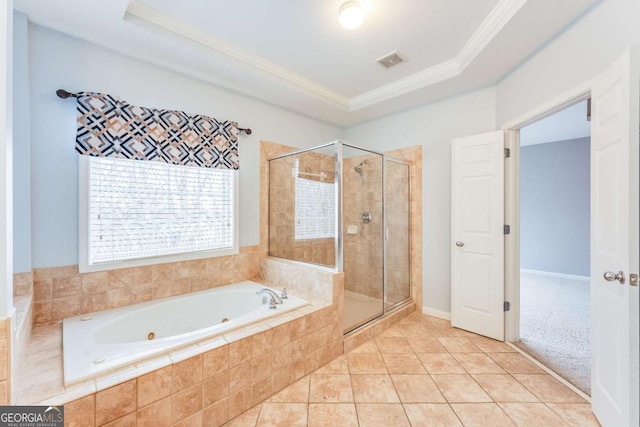 bathroom with ornamental molding, a tray ceiling, tile patterned floors, and plus walk in shower