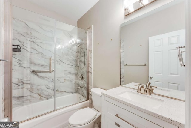 full bathroom featuring vanity, shower / bath combination with glass door, and toilet