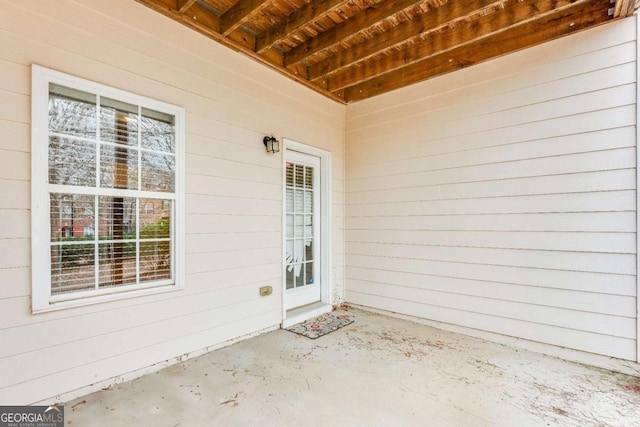 property entrance featuring a patio area