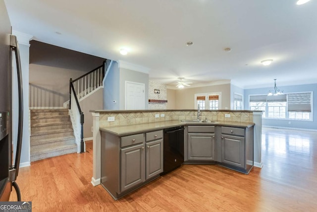 kitchen with sink, dishwasher, tasteful backsplash, stainless steel fridge with ice dispenser, and decorative light fixtures