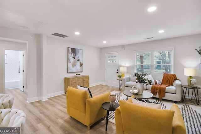 living room with light hardwood / wood-style flooring