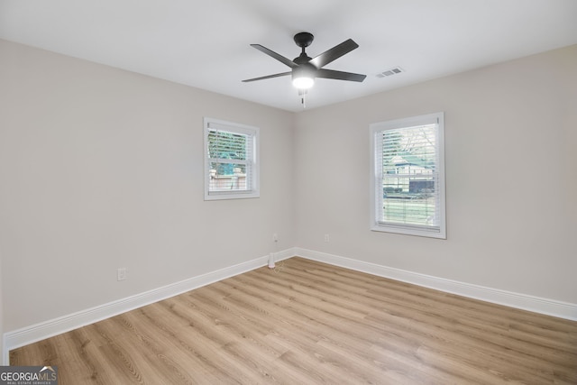 unfurnished room featuring ceiling fan and light hardwood / wood-style flooring