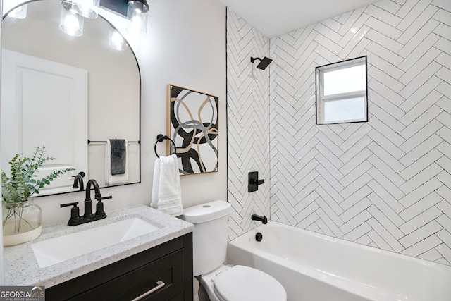 full bathroom with vanity, toilet, and tiled shower / bath