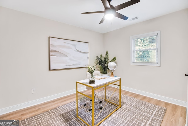 office featuring ceiling fan and hardwood / wood-style floors