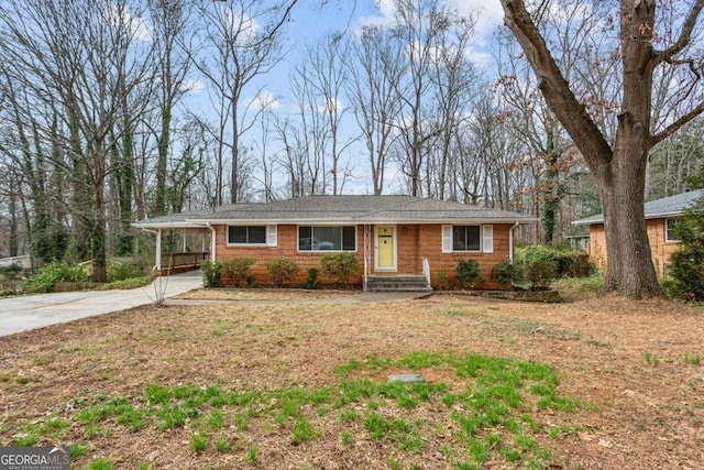 single story home featuring a carport