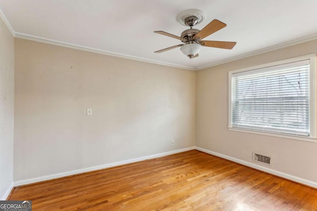 unfurnished room featuring ornamental molding, ceiling fan, and light hardwood / wood-style floors