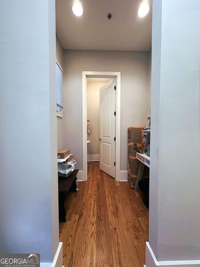 hallway featuring wood-type flooring