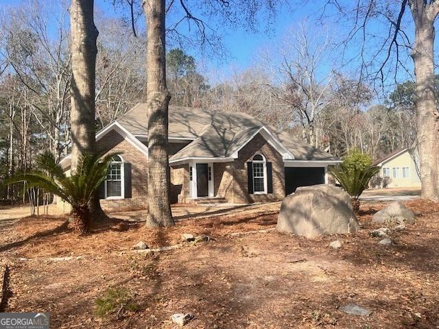 single story home with a garage