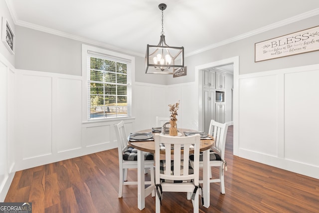 dining room with ornamental molding, dark hardwood / wood-style flooring, and a notable chandelier