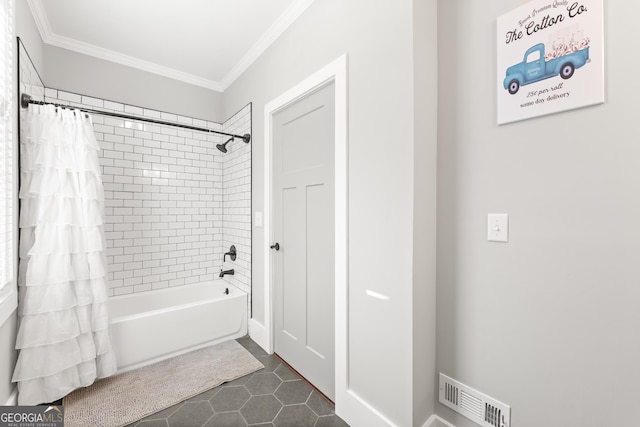 bathroom featuring tile patterned flooring, crown molding, and shower / tub combo