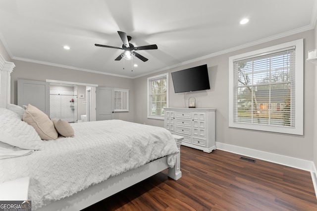 bedroom featuring dark wood-type flooring, ceiling fan, ornamental molding, and ensuite bathroom