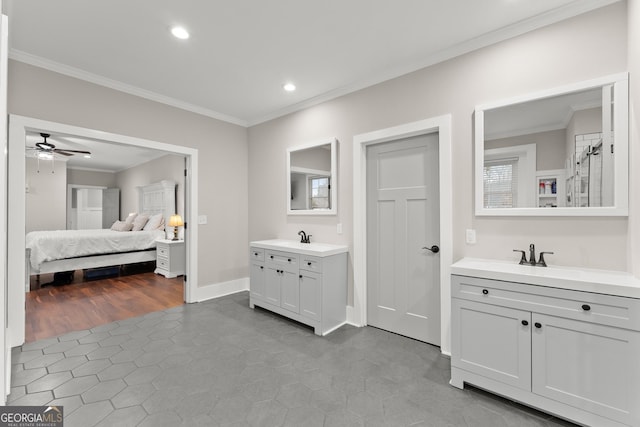 bathroom with ceiling fan, ornamental molding, and vanity