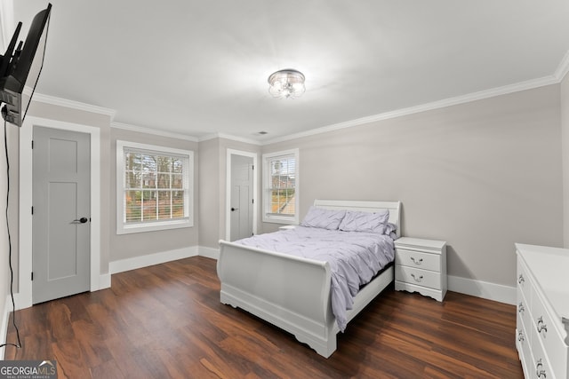 bedroom featuring crown molding, dark hardwood / wood-style flooring, and multiple windows