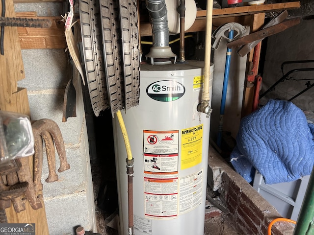 utility room featuring gas water heater