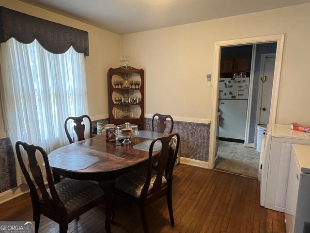 dining area featuring dark hardwood / wood-style flooring