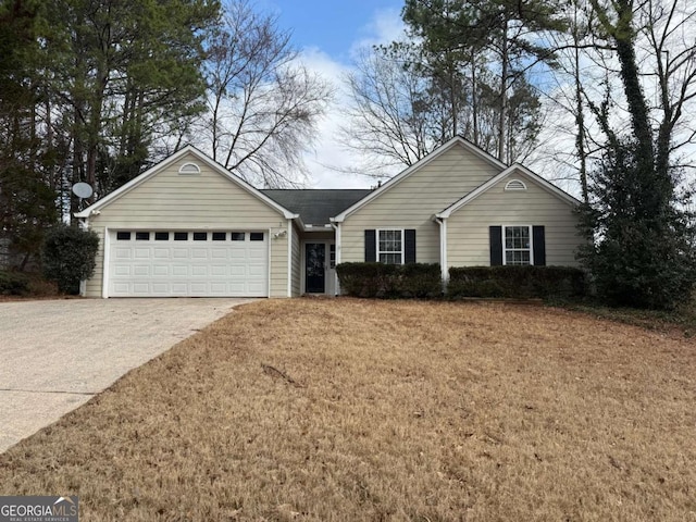 ranch-style house with a garage and a front yard