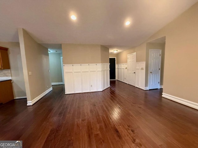 unfurnished living room featuring dark wood-type flooring