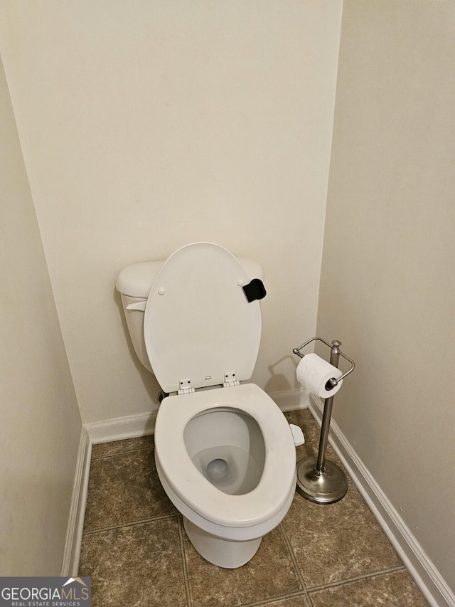 2764 Keystone Ave, Lithonia, GA 30058 - bathroom with toilet, tile patterned flooring, and baseboards