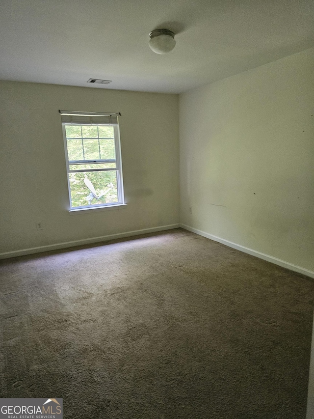 2764 Keystone Ave, Lithonia, GA 30058 - carpeted spare room with baseboards