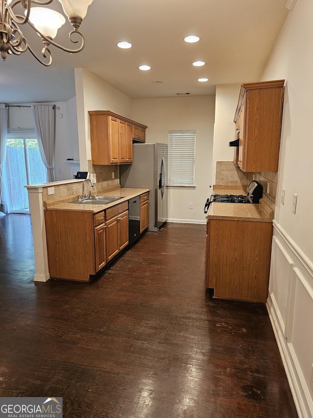 2764 Keystone Ave, Lithonia, GA 30058 - kitchen with a sink, range with gas cooktop, light countertops, dishwashing machine, and decorative backsplash