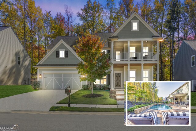 view of front facade with a porch, central AC unit, a garage, a front lawn, and a balcony