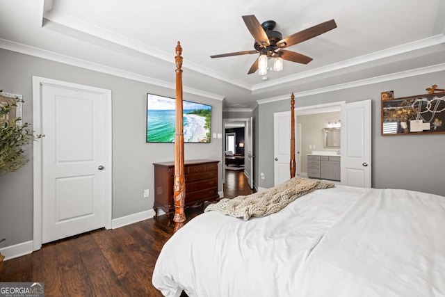 bedroom with crown molding, ceiling fan, ensuite bathroom, dark hardwood / wood-style flooring, and a raised ceiling