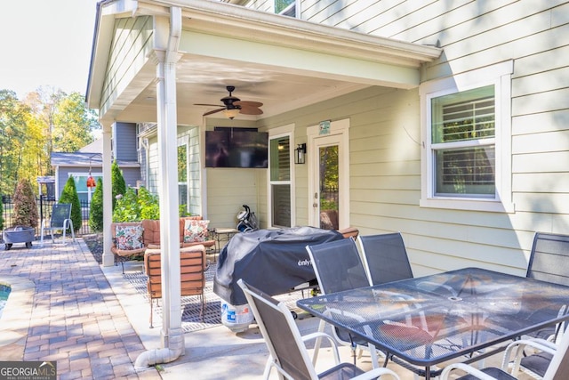 view of patio / terrace featuring area for grilling and ceiling fan