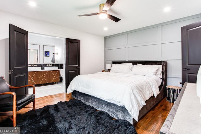 bedroom featuring dark hardwood / wood-style floors and ceiling fan