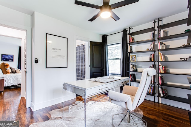 home office featuring ceiling fan and dark hardwood / wood-style flooring