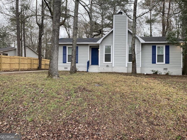 ranch-style house with a chimney, fence, a front lawn, and crawl space