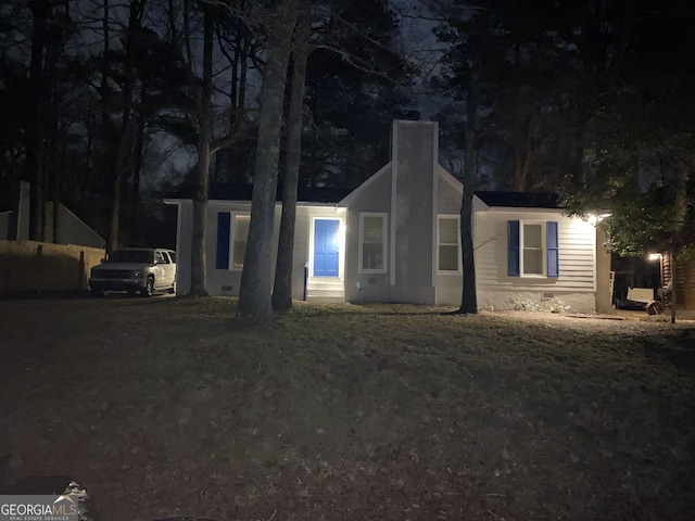 view of front of home with a chimney