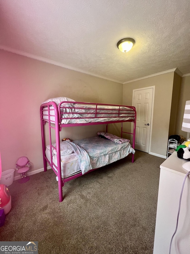 bedroom with crown molding, carpet flooring, and a textured ceiling