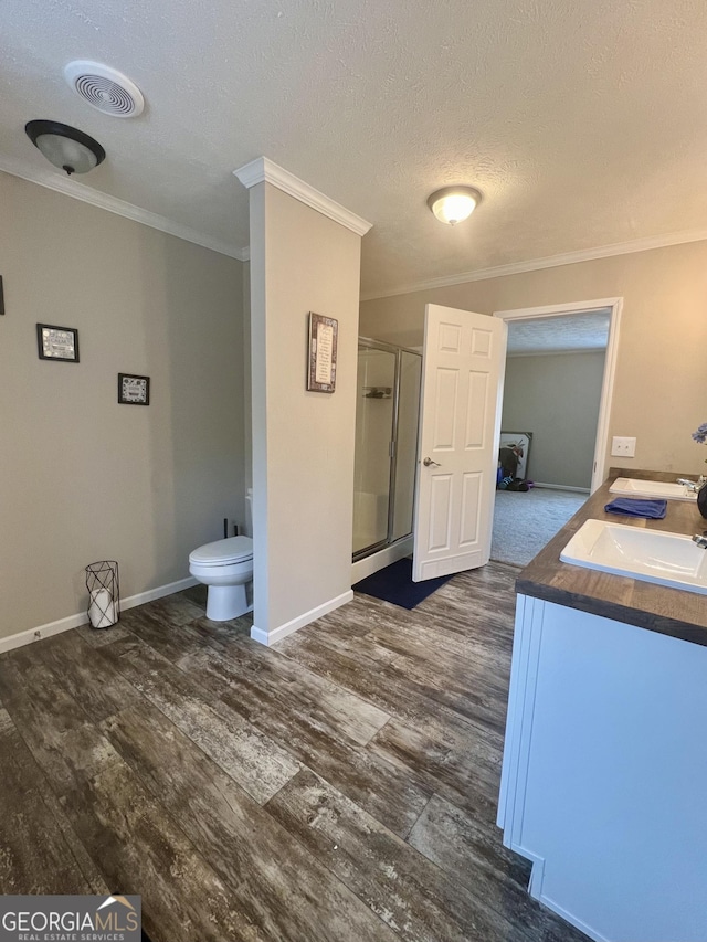 bathroom featuring walk in shower, wood-type flooring, and crown molding