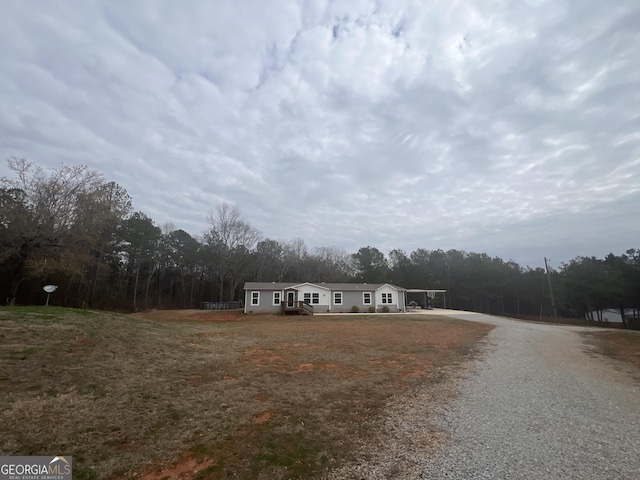 view of front of home with a carport