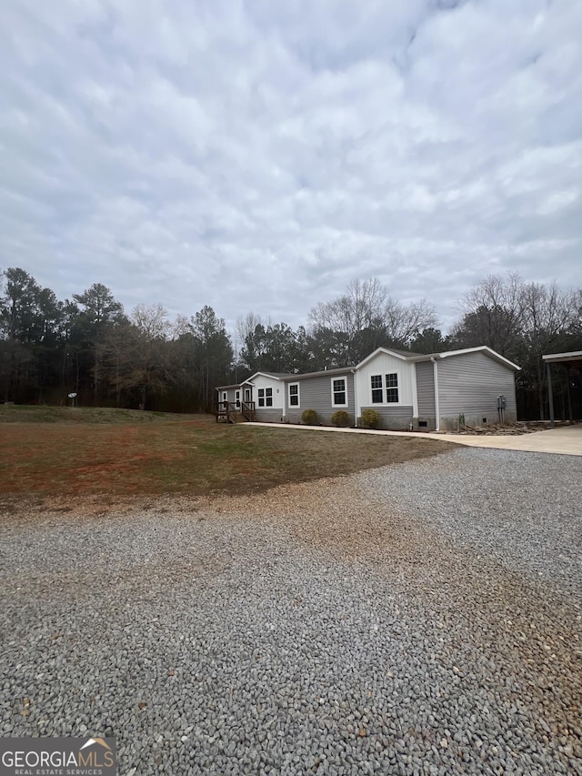 ranch-style house with a front lawn