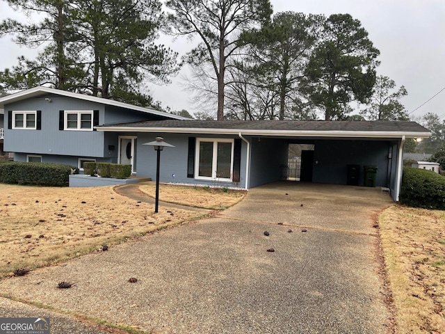 tri-level home featuring a carport