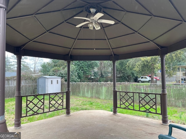 view of patio with a shed, a gazebo, and ceiling fan